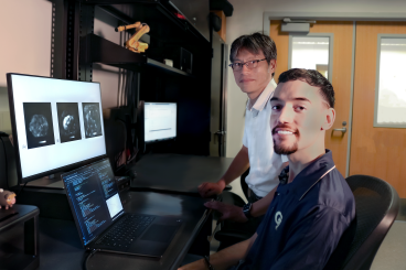 Professor Jun Ueda in the George W. Woodruff School of Mechanical Engineering and robotics Ph.D. student Heriberto Nieves.